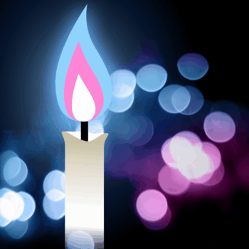 A candle with a blue and pink flame flickers in tribute against a backdrop of blue and pink bokeh lights, embodying the spirit of Transgender Day of Remembrance.