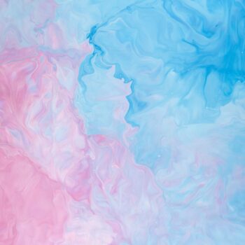 Abstract swirling pattern in pastel blue and pink hues.
